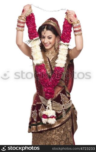 Beautiful bride holding a garland