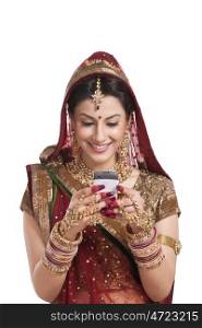 Beautiful bride looking at an sms