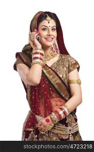 Beautiful bride talking on a mobile phone