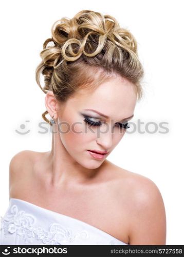 Beautiful bride with fashion wedding hairstyle - on white background