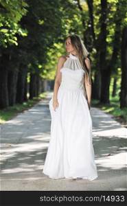 beautiful bride woman people in fashion wedding dress posing outdoor in bright park