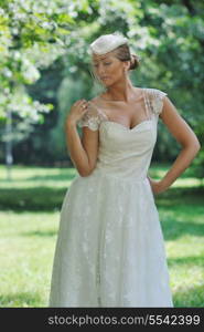 beautiful bride woman people in fashion wedding dress posing outdoor in bright park