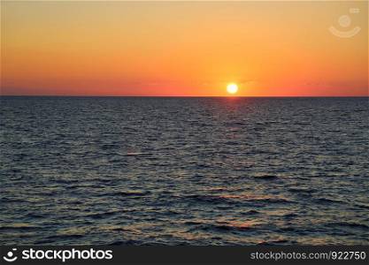 Beautiful bright sunset on the sea, Greece