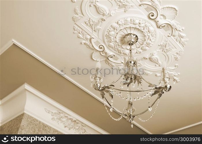 beautiful bronze chandelier in a modern apartment