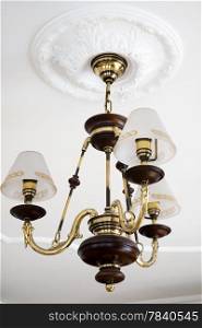 beautiful bronze chandelier in a modern apartment