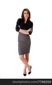 Beautiful brunette business woman standing wearing gray skirt and blue blouse with arms crossed, isolated