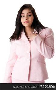Beautiful brunette Caucasian Hispanic Latina successful confident career business woman standing, wearing pink suit and hand on chest, isolated.