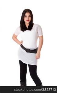 Beautiful brunette Caucasian Hispanic Latina woman with red lipstick standing with hand on hip, wearing white shirt and black leggings, isolated.