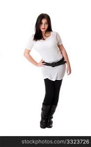 Beautiful brunette Caucasian Hispanic Latina woman with red lipstick standing with hand on hip, wearing white shirt, black leggings and belt, isolated.