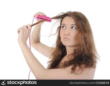 Beautiful brunette doing her hair. Isolated on white background