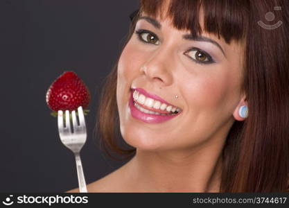 Beautiful Brunette getting ready to eat some fruit. Beautiful Brunette