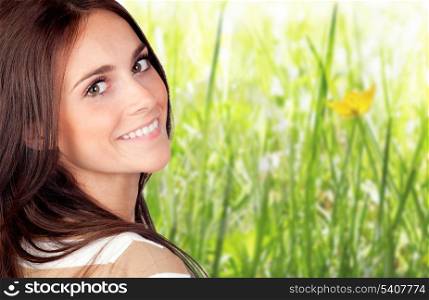 Beautiful brunette girl with herbs of background
