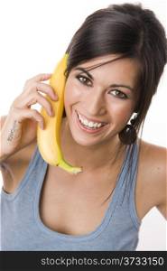 Beautiful Brunette holds a Banana like a phone. Beautiful Brunette holds a Banana