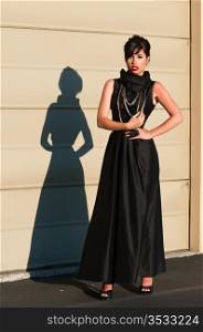 Beautiful brunette in a long black gown