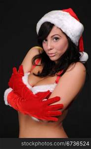 Beautiful brunette in a sexy Santa&rsquo;s helper outfit