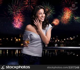 Beautiful brunette on a fireworks background