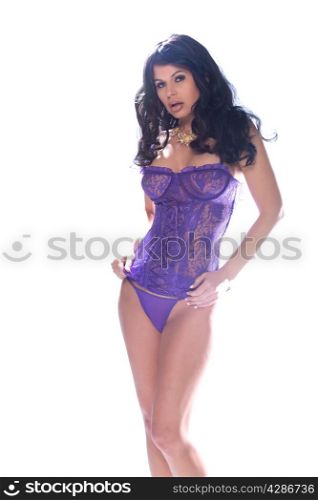 Beautiful brunette woman in a purple corset