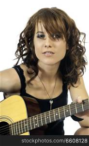 Beautiful brunette woman playing an acoustic guitar