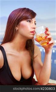 beautiful brunette woman with glass of whisky