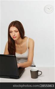 Beautiful brunette woman with laptop