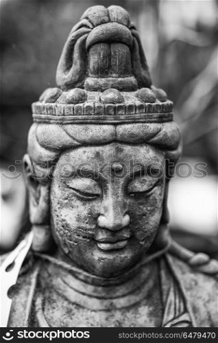 Beautiful Buddha statue portrait with shallow depth of field for. Stunning Buddha statue portrait with shallow depth of field for drawing attention to the face
