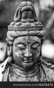 Beautiful Buddha statue portrait with shallow depth of field for. Stunning Buddha statue portrait with shallow depth of field for drawing attention to the face