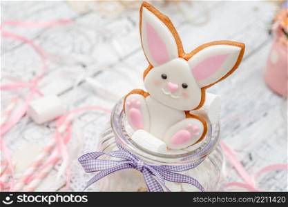 Beautiful bunny glazed Easter cookie on wooden table. Beautiful bunny glazed Easter cookie