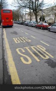 beautiful bus stop sign with red british typical transportation in Cheltenham?s promenade, England