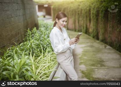 Beautiful business woman is working outside office