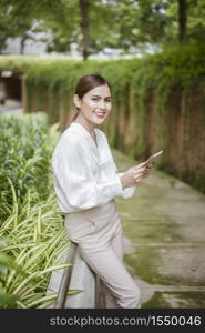 Beautiful business woman is working outside office