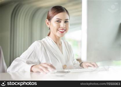 Beautiful business woman is working with her computer