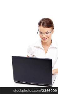 Beautiful business woman looks in the screen of the laptop isolated