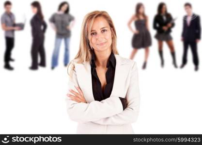 Beautiful business woman posing with group of people in the back