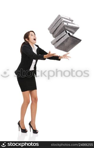 Beautiful business woman stumble while carrying lots of folders on hands, isolated over white background