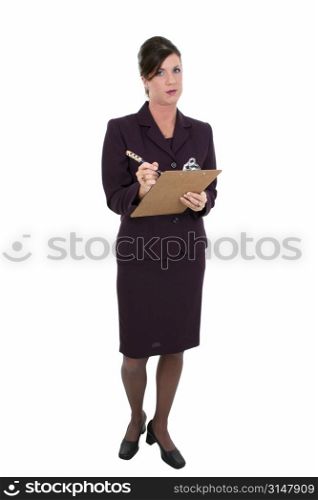 Beautiful Businesswoman Taking Notes. Holding pen and clipboard. Disapointed expression.
