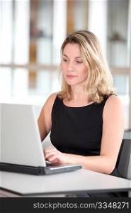 Beautiful businesswoman working on laptop computer