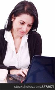 Beautiful businesswoman working on laptop in the office