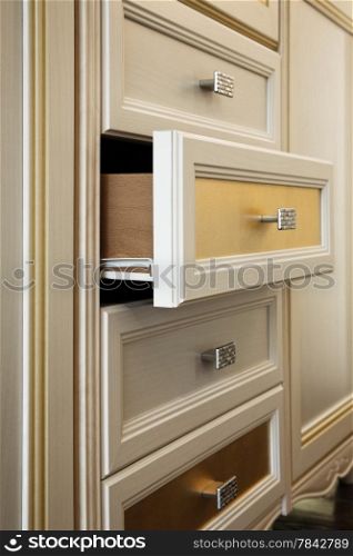 beautiful cabinet with drawers in a modern room
