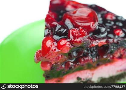 beautiful cake with berries on a plate isolated on white