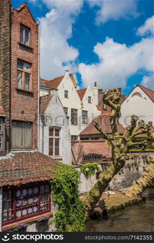 Beautiful canal and old brick buildings of Bruges Belgium