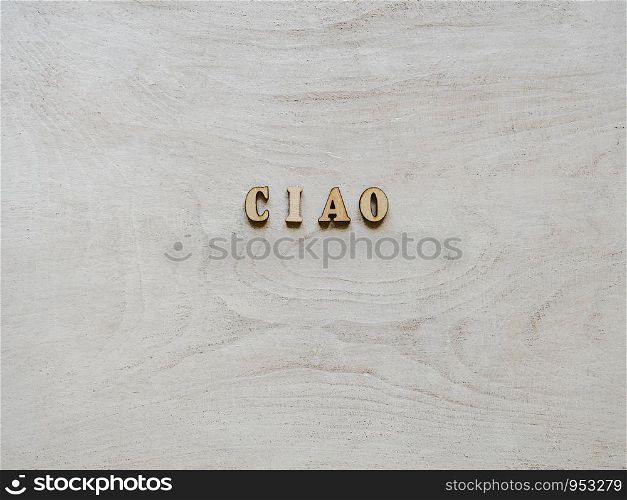 Beautiful card with unpainted wooden letters lying on a white board. Top view, close-up. Isolated background. Congratulations to loved ones, relatives, friends, colleagues. Wooden letters lying on a white board