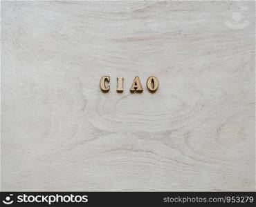 Beautiful card with unpainted wooden letters lying on a white board. Top view, close-up. Isolated background. Congratulations to loved ones, relatives, friends, colleagues. Wooden letters lying on a white board