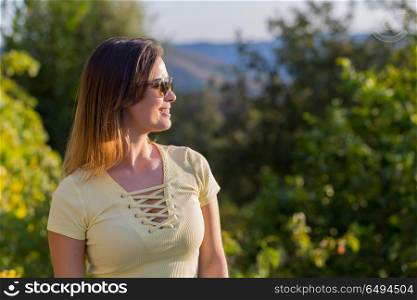 beautiful casual woman enjoying the sun, outdoor. enjoying the sun