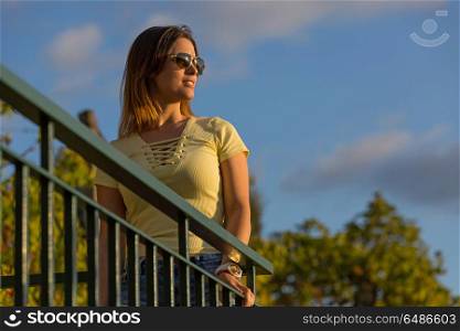 beautiful casual woman enjoying the sunset, outdoor. sunset