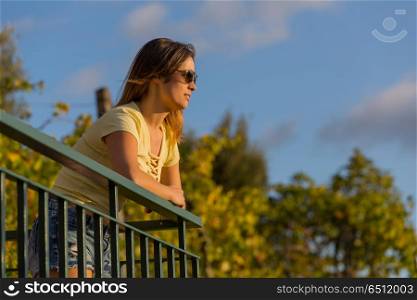 beautiful casual woman enjoying the sunset, outdoor. sunset