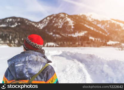 Beautiful Caucasian girl is taking a walk. Winter landscape, Austria