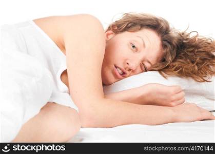 beautiful caucasian woman is just wake in bed at morning