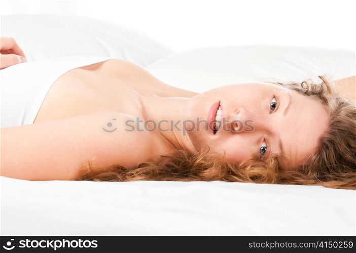 beautiful caucasian woman is lying in bed at morning