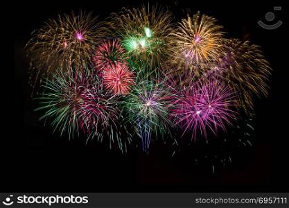Beautiful celebration golden, red, purple, green sparkling fireworks. Independence Day, 4th of July holidays salute. New Year beautiful fireworks. Holidays symbol background.. Beautiful celebration golden, red, purple, green sparkling firew