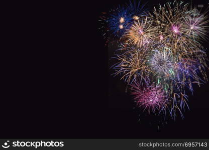 Beautiful celebration lilac, purple and golden fireworks. 4th of July beautiful fireworks. Independence Day, New Year holidays salute, copy space.. Beautiful celebration lilac, purple and golden fireworks